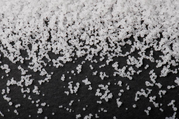 white pvs granules on black background macro close up view